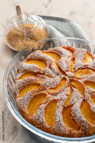 Homemade peach cake with po...