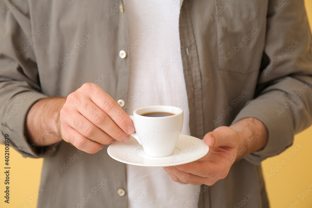 Young man with cup of hot coffee, closeup Young man with cup of hot coffee, closeup