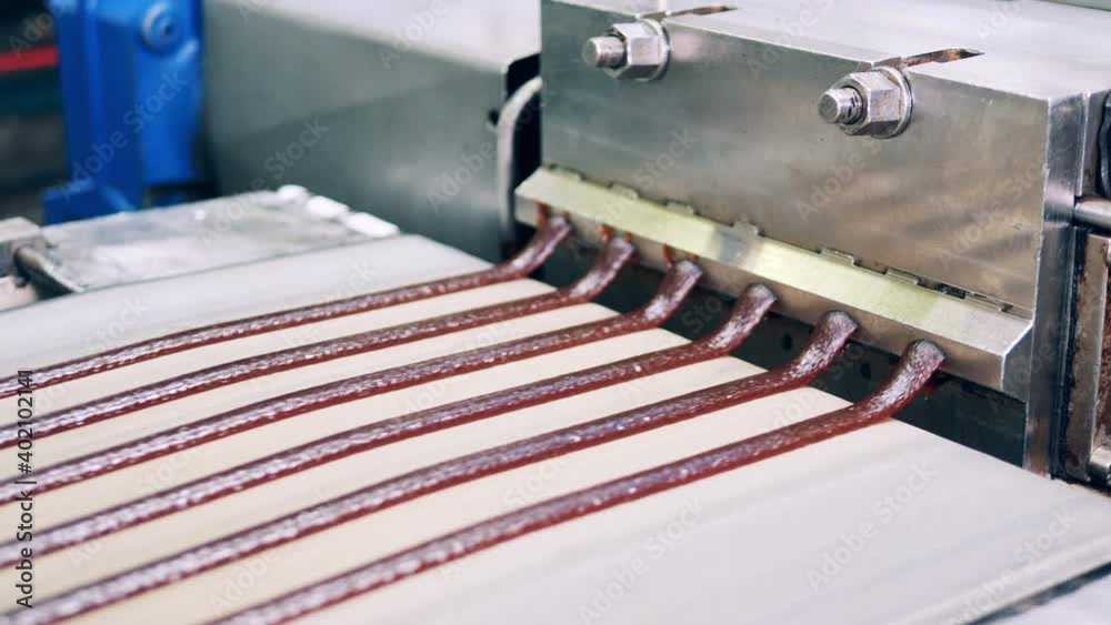 Sweet paste is being manufactured by a factory machine Sweet paste is being manufactured by a factory machine