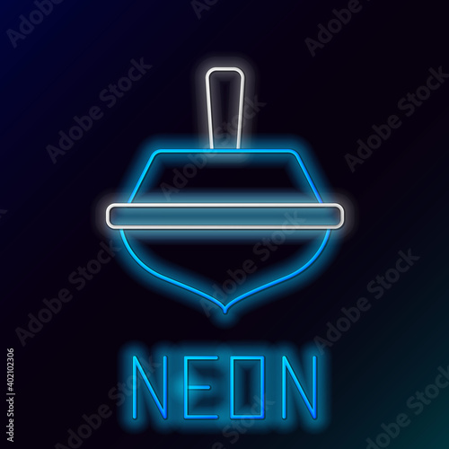 Glowing neon line Hanukkah dreidel icon isolated on black background. Colorful outline concept. Vector. photo