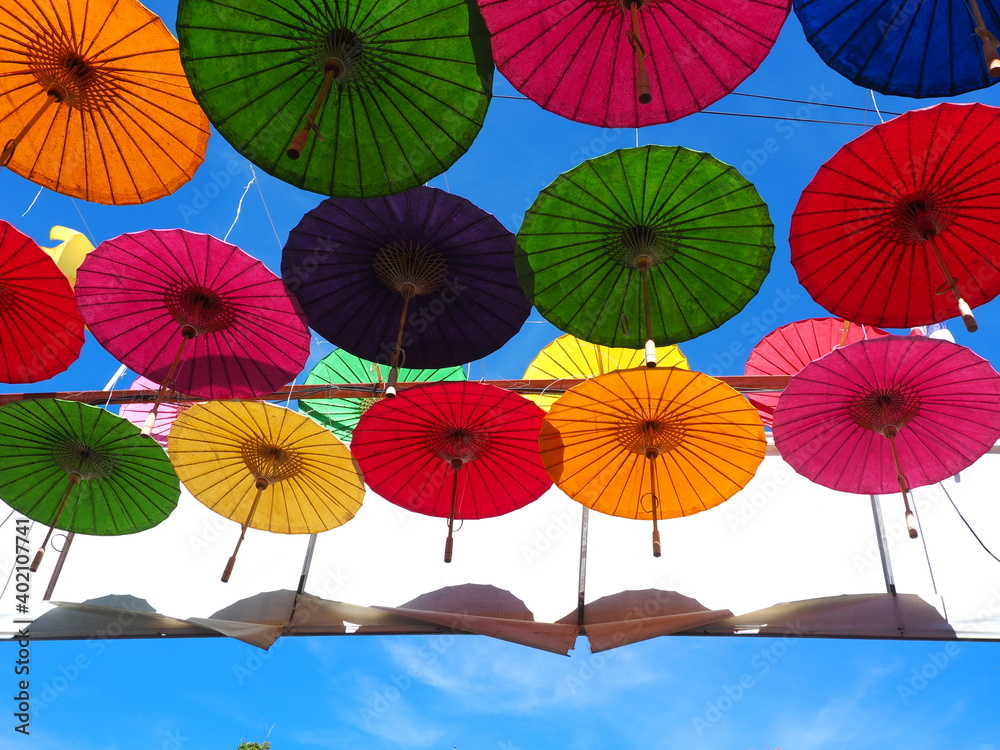 Obraz premium Colorful fabric umbrella, Famous decoration item in festival or ceremony. Abstract idea of alternative sexual concept. 