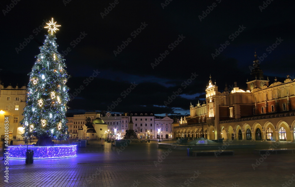 Night cityscape of winter Krakow, Christmas tree on Main market squere