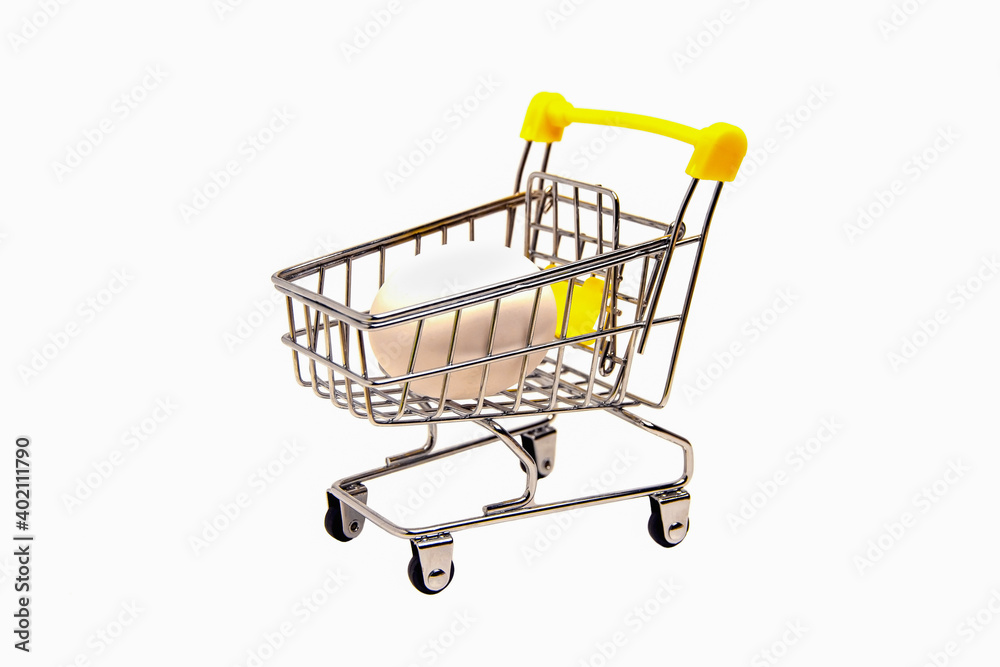 Shopping cart with egg inside, isolated on white background Shopping cart with egg inside, isolated on white background
