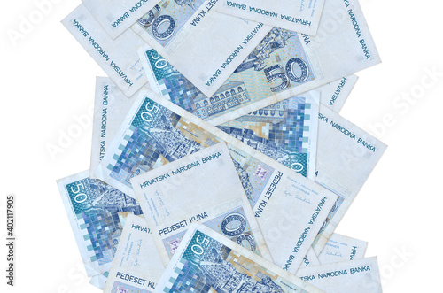 50 Croatian kuna bills flying down isolated on white. Many banknotes falling with white copyspace on left and right side photo