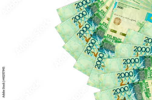 2000 Kazakhstani tenge bills lies isolated on white background with copy space. Rich life conceptual background photo