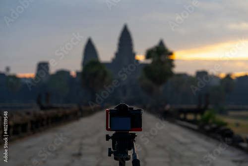 Camera on the tripod in front of Ankgor wat temple