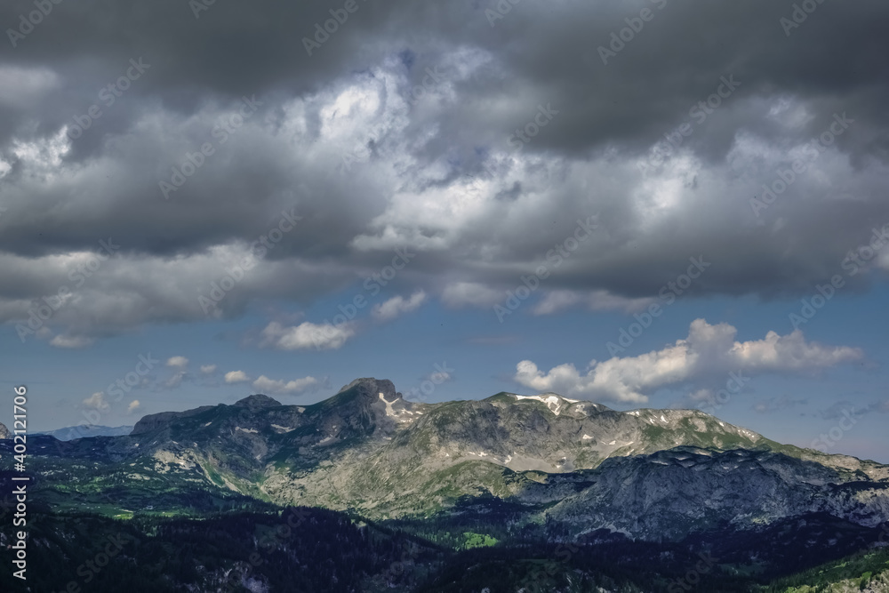 wonderful mountains and dark rainclouds on the sky