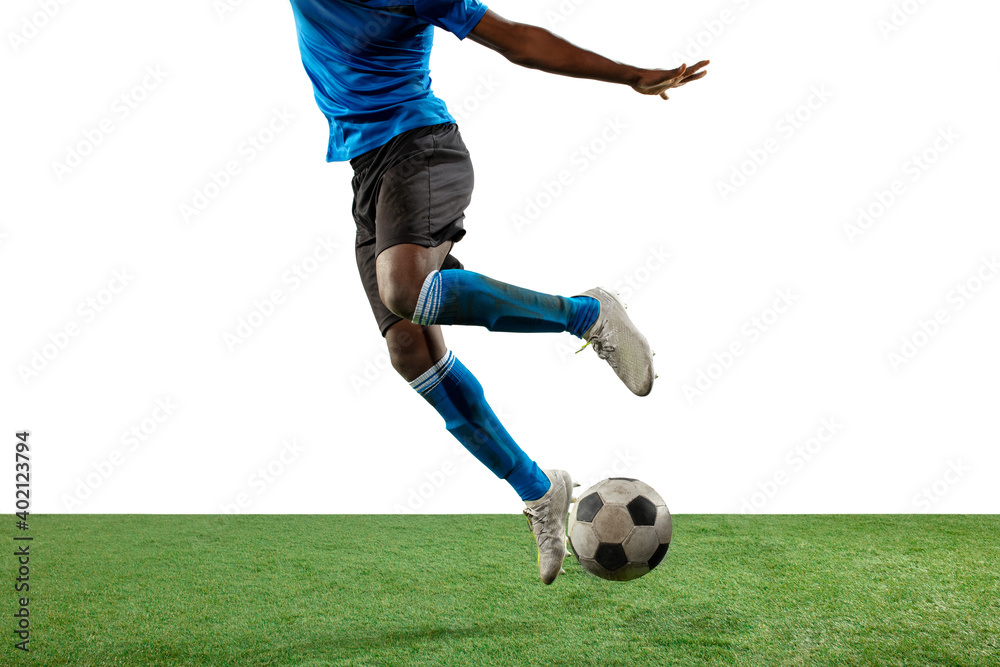 Close up legs of professional soccer, football player fighting for ball on field isolated on white background. Concept of action, motion, high tensioned emotion during game. Cropped image.