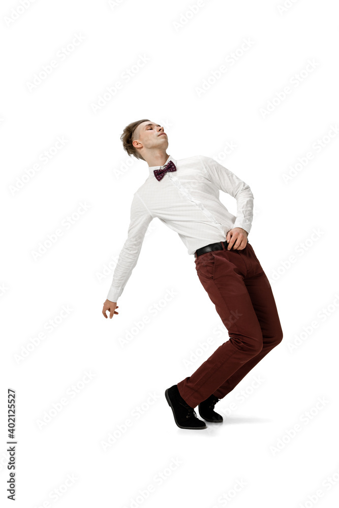 Icon. Happy young man dancing in casual clothes or suit, remaking legendary moves and dances of celebrity from culture history. Isolated on white. Action, motion, fame concept. Creative occupation.