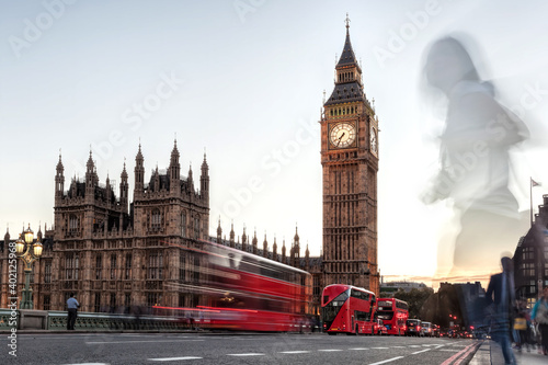 Big Ben with red buses on the bridge in the evening  London  England  United Kingdom