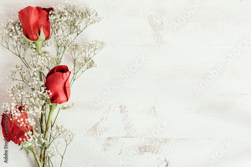 Fototapeta Naklejka Na Ścianę i Meble -  red roses and white flowers composition with copy space