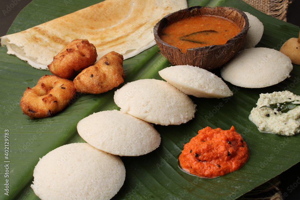 Group of South Indian food like Masala Dosa, Idli, Wada or vada, sambar