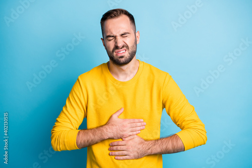 Schilderij op canvas Photo portrait of man grimacing touching stomach injury poisoning disbalance dia