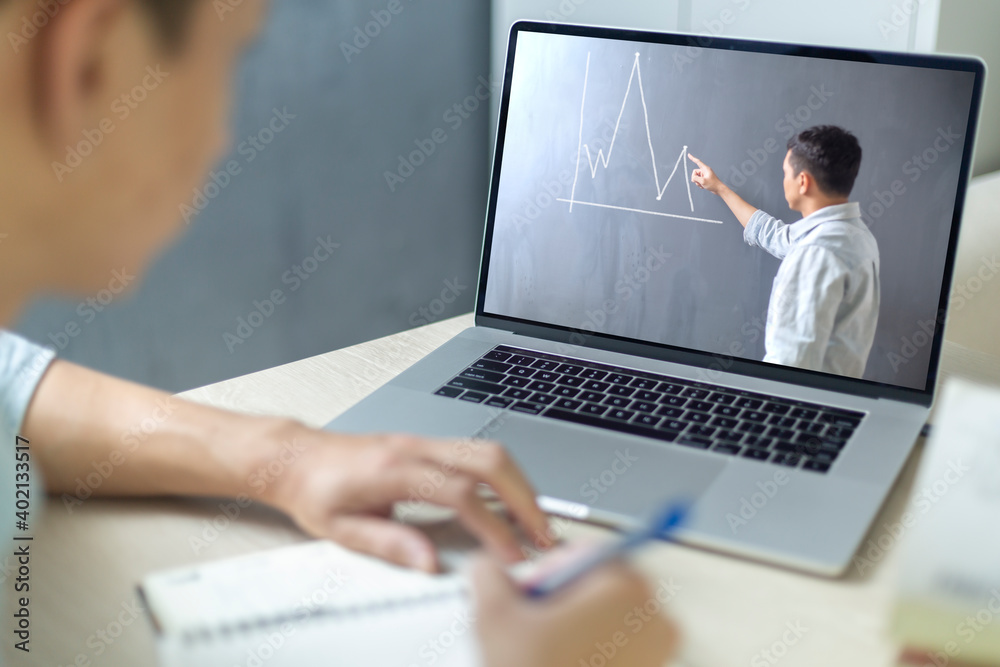 A man online learning classroom and social distancing in new normal concept A man online learning classroom and social distancing in new normal concept