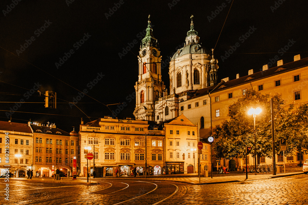 Night view of the illuminated St Nicolas church, Malostranske namesti,Prague,Czech republic.Baroque church in the Lesser Town of Prague.Night city scene.Famous tourist destination.Czech architecture.