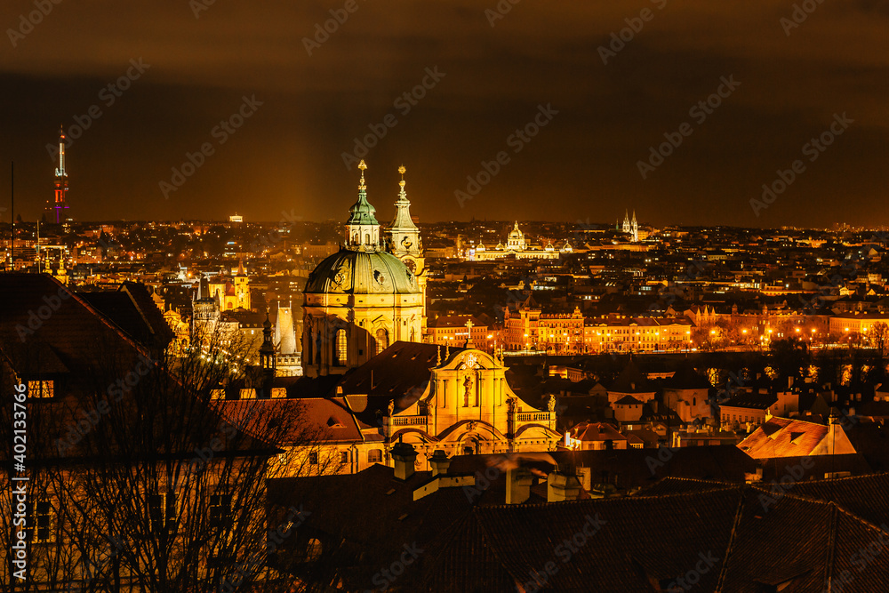 Naklejka premium Night view of Old town with hictorical buildings,churches,towers in Prague,Czech republic.Prague evening panorama.Amazing European cityscape.Night city lights.Travel city concept.Urban scenery