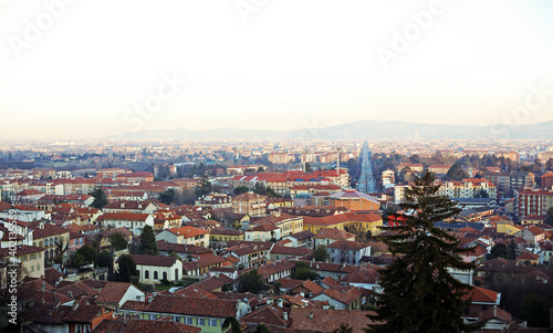 High angle landscape of Turin city, Piedmont region, North Italy with red roofs and road  © mynoemy1