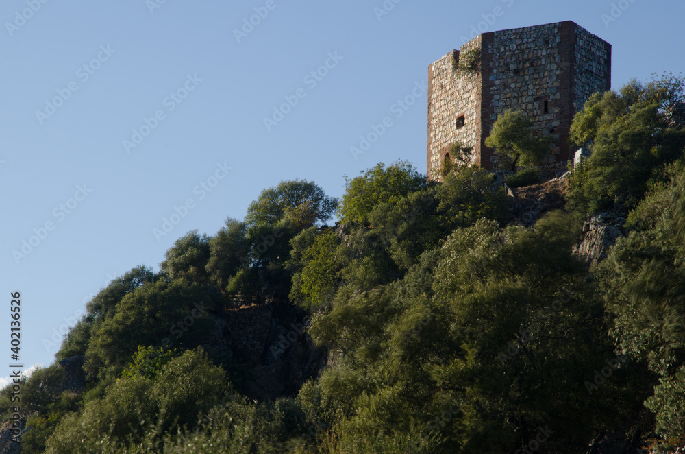 Monfrague castle on a hill covered of Mediterranean forest. Monfrague National Park. Caceres. Extremadura. Spain. Monfrague castle on a hill covered of Mediterranean forest. Monfrague National Park. Caceres. Extremadura. Spain.