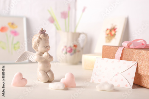 ceramic cupid figurine letter with hearts and gift