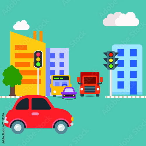 City life with tall multistore buildings with traffic lights and vehicles like car bus truck waiting in main road for signal in broad day light with clouds in sky © Abhishek