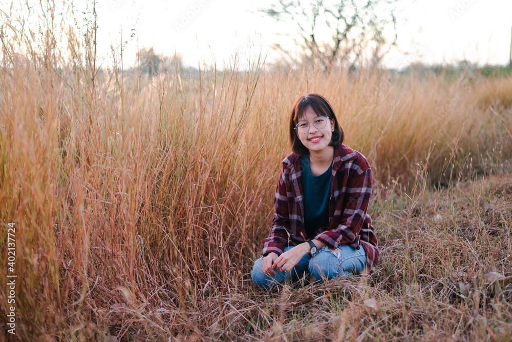 Thai girl or Chinese Girl enjoy on holiday.Asian teenage girl in a autumn rural meadow,vintage style concept. Thai girl or Chinese Girl enjoy on holiday.Asian teenage girl in a autumn rural meadow,vintage style concept.