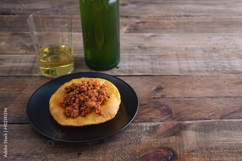 Mincemeat with corn and cider cakes on a wooden base. Copy space. photo