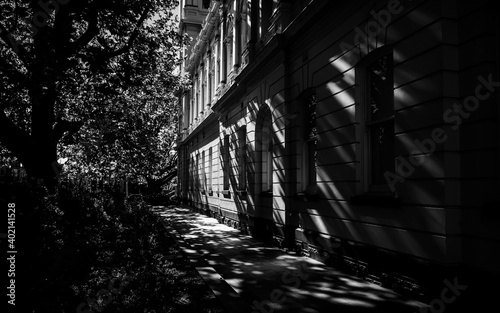 Black and white building exterior with sunlight