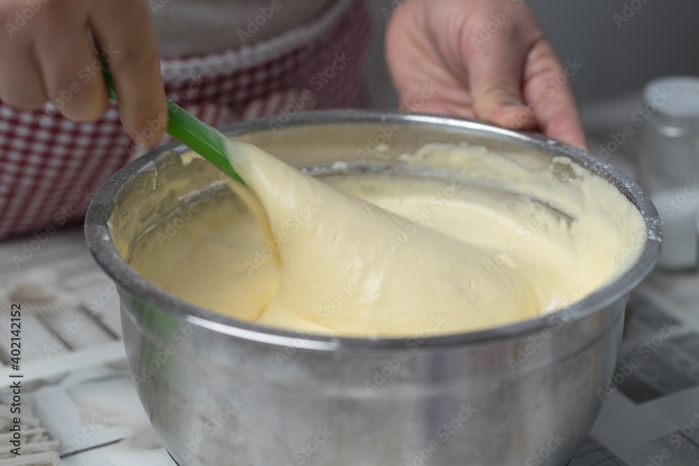 mixing the pastry dough in a stainless steel bowl mixing the pastry dough in a stainless steel bowl