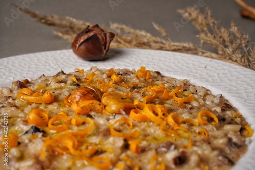 Risotto with chestnuts and citrus. Top view.