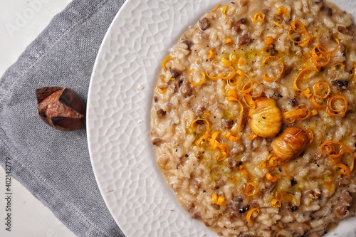 Risotto with chestnuts and citrus. Top view.