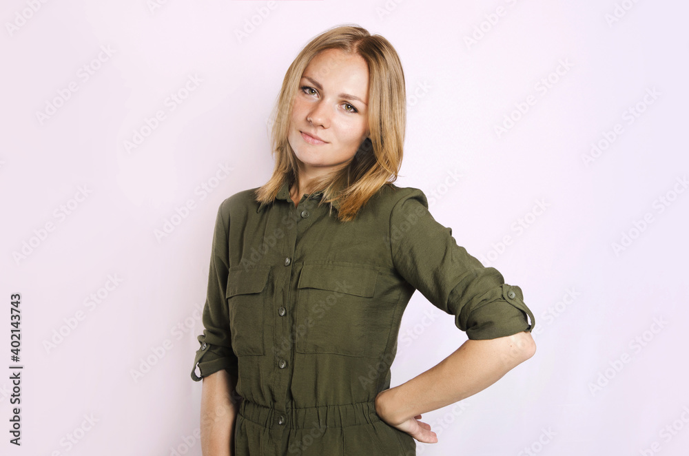 Young beautiful blond female with green shirt on white background Young beautiful blond female with green shirt on white background