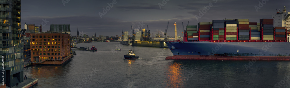 large container ship during a turning maneuver in the port of Hamburg 