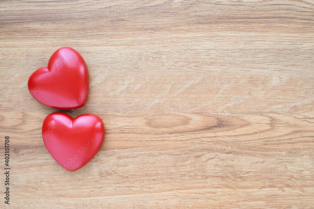 Close-up of Red heart shapes on wooden table background. Decoration minimal design. Valentine's Day, Symbol of love, wedding and sweet, romantic moment. Concept Love and Valentines with copy space. Close-up of Red heart shapes on wooden table background. Decoration minimal design. Valentine's Day, Symbol of love, wedding and sweet, romantic moment. Concept Love and Valentines with copy space.