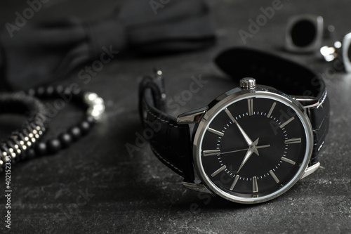 Luxury wrist watch on black background, closeup