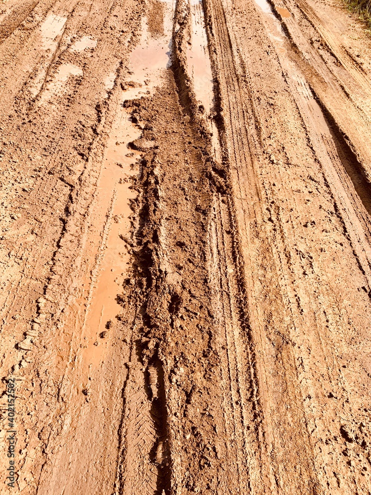 Muddy bumpy path in detail. Impassable road Muddy bumpy path in detail. Impassable road