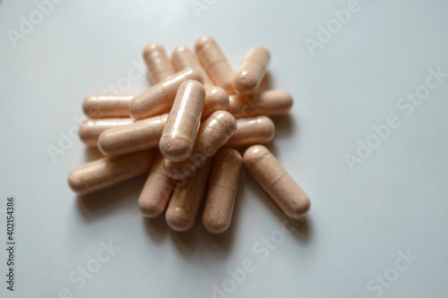 Closeup of handful of probiotic dietary supplements photo