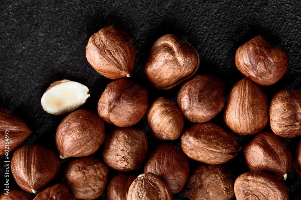 Obraz premium Close up of Hazelnut kernels - Food Frame Background, macro detailed close up.