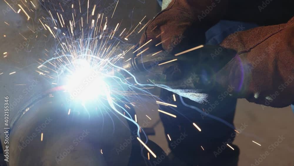 Grinding Work with Smooths Equipment for Steel Metal, Iron, Sparks at Manufacturing Heavy Industry Factory Closeup Indoor. Metalwork Assembly, Heat Detail Welding by Professional Laborer Using Grinder