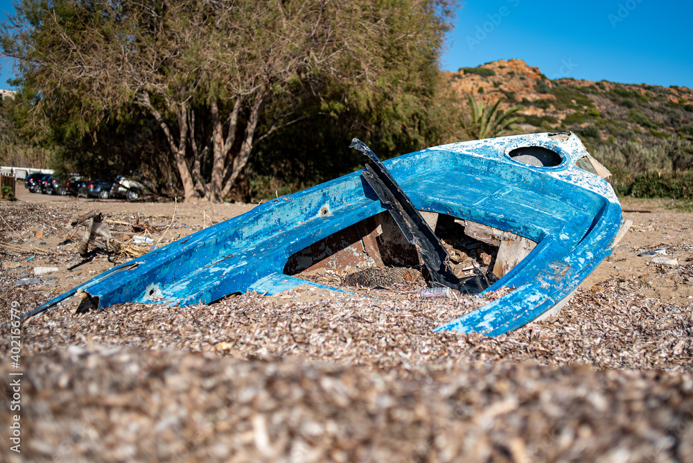 Sounio, Greece - December 08, 2017: Abandoned fishing boat on the beach Sounio, Greece - December 08, 2017: Abandoned fishing boat on the beach