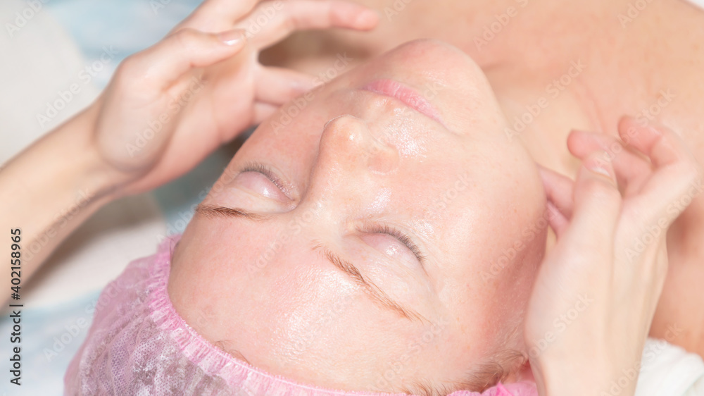 Beauty and wellness treatments. Body care, Skin care. A woman enjoys a relaxing massage in a beauty salon. The view from the top