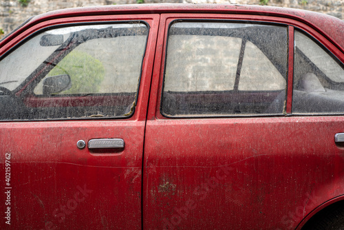 Ioannina, Tzoumetka, Epirus, Greece - March 29, 2018: Abandoned red car
