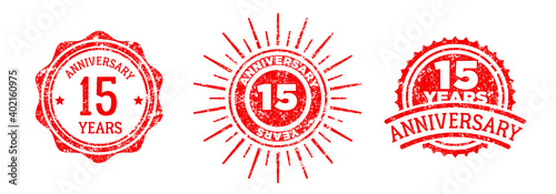 A group of 15 years anniversary logos drawn in the form of stamps, red frames for celebration. Grunge rubber stamp texture. Holiday stamps. Collection of postage stamps. Vector round stamps