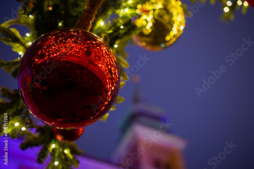 Huge Christmas balls against the background of the castle tower photo