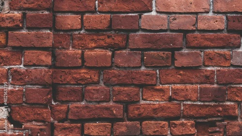 Zooming  red brick wall of an old loft style building. Clean vintage brick wall as texture background. 