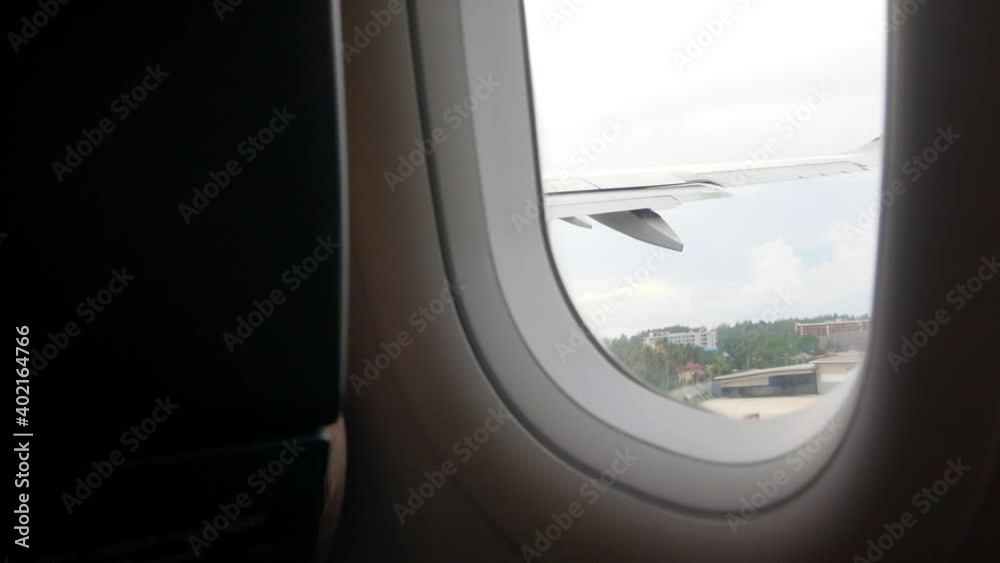 View of Window in airplane above sky View of Window in airplane above sky