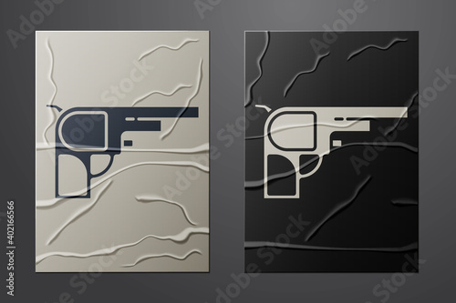 White Revolver gun icon isolated on crumpled paper background. Paper art style. Vector.