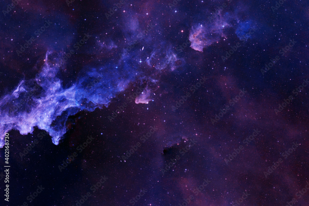 Fototapeta premium A blue galaxy with stars and nebulae. Elements of this image were furnished by NASA.