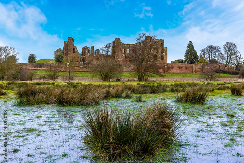 The marsh of the "Great Mere", Kenilworth, UK with a backdrop of the ruins of the Kenilworth castle on a bright winters day