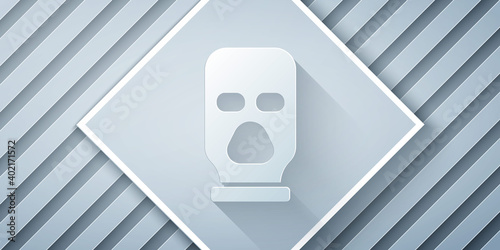 Paper cut Balaclava icon isolated on grey background. A piece of clothing for winter sports or a mask for a criminal or a thief. Paper art style. Vector.