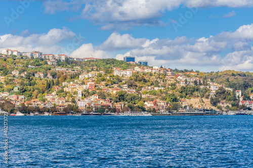 Fototapeta Naklejka Na Ścianę i Meble -  Cityscape of  Golden horn with ancient and modern buildings in Istanbul Turkey from the Bosphorus strait on a sunny day with background cloudy sky